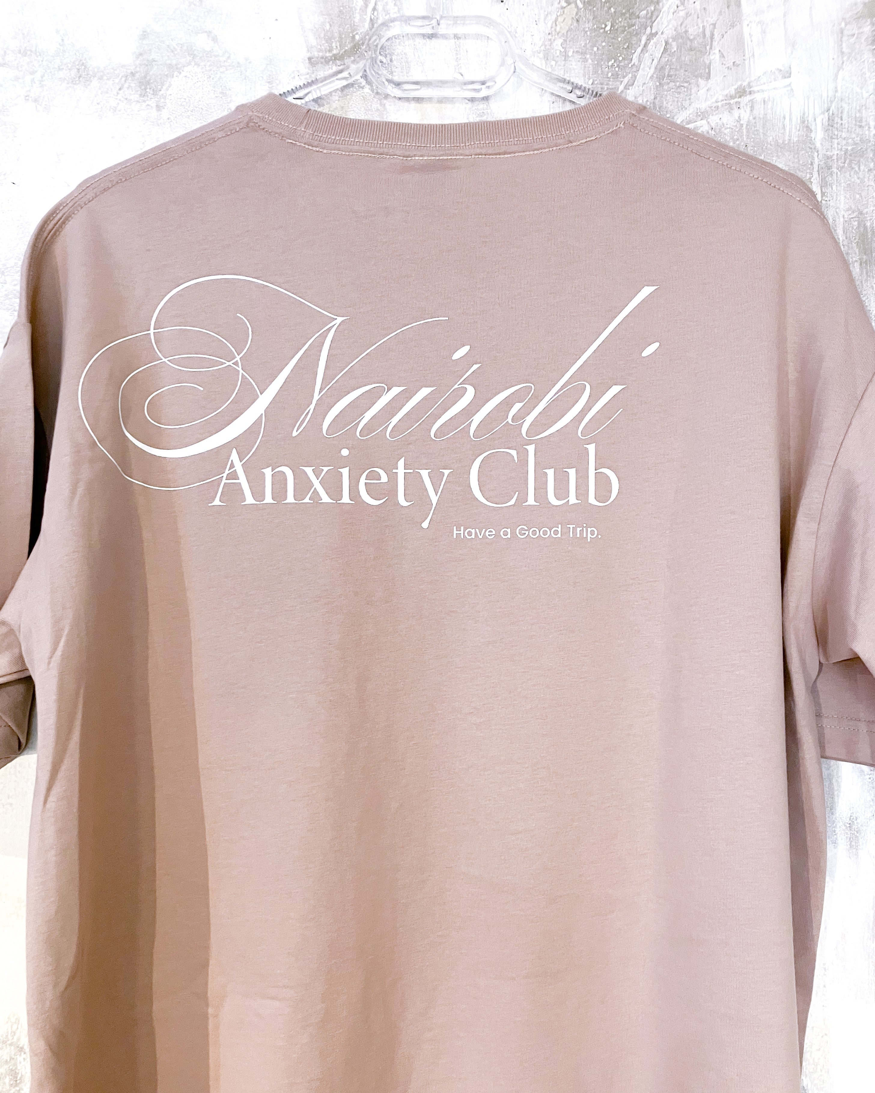Nairobi Anxiety Club Smokey Pink T-shirt with White Ink
