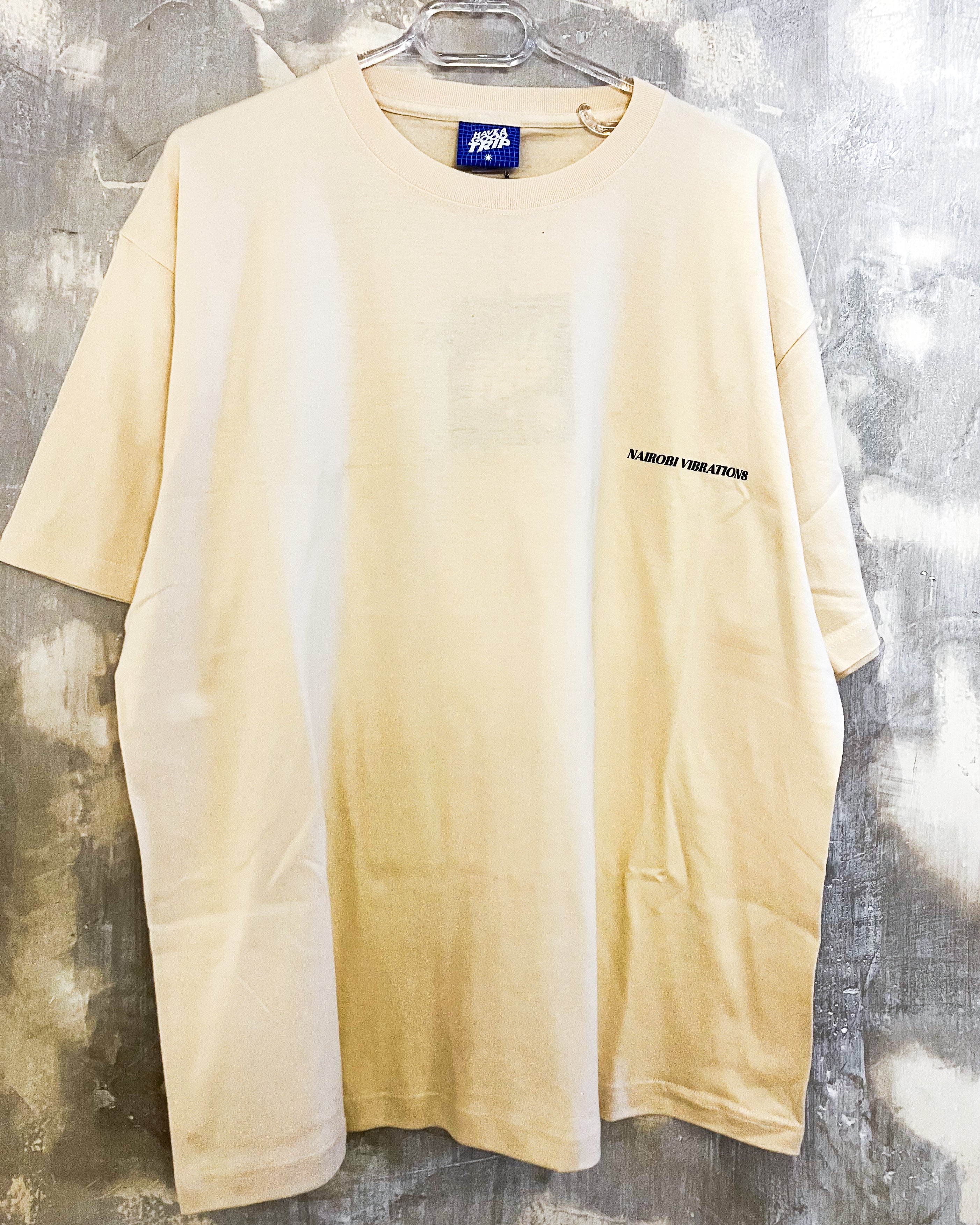 Nairobi Vibrations Beige T-Shirt with Green Ink