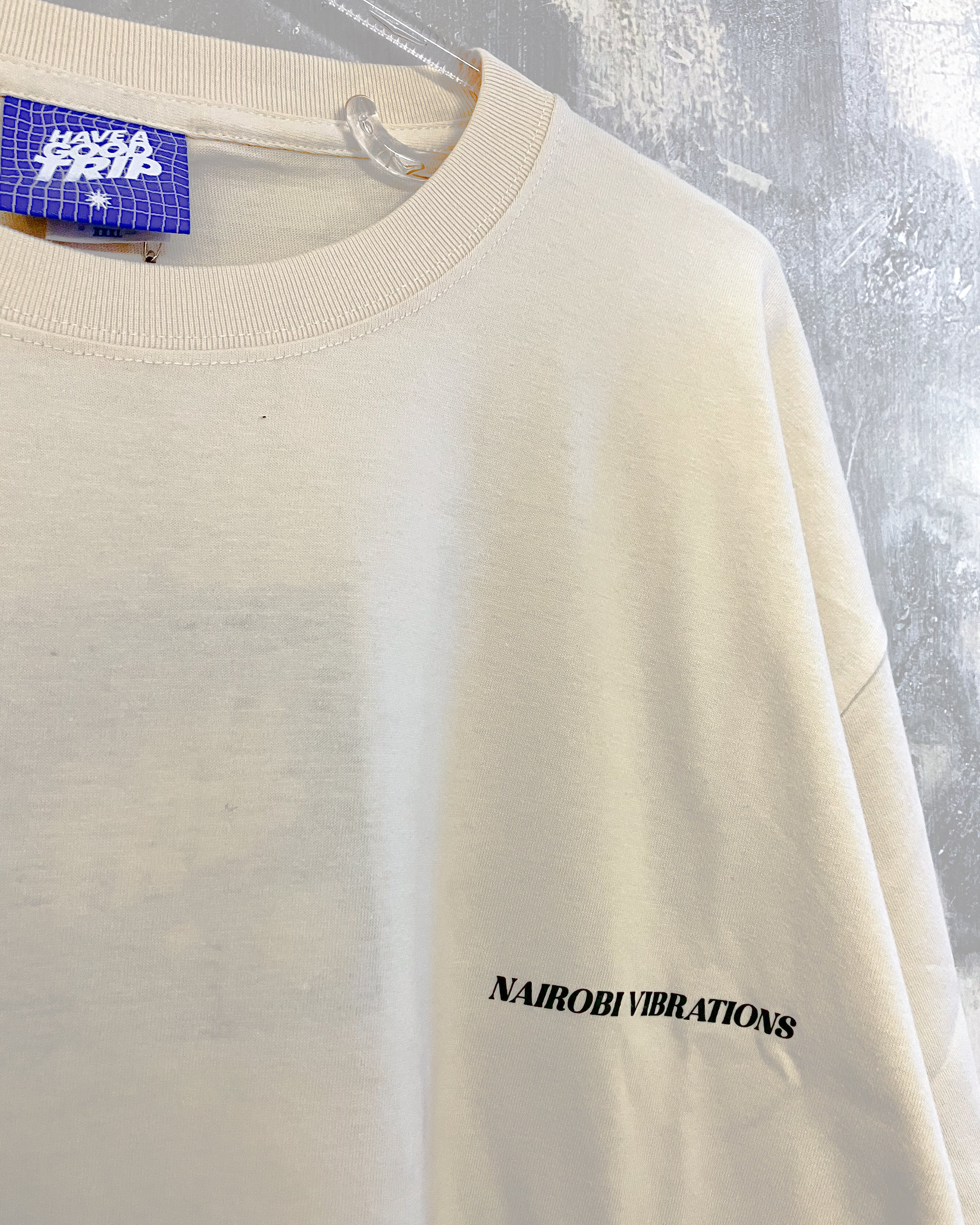 Nairobi Vibrations Beige T-Shirt with Green Ink