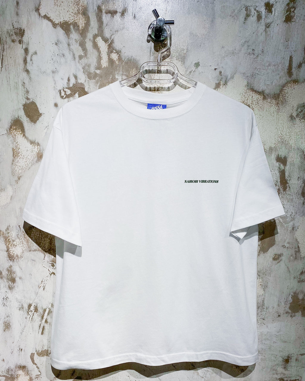 Nairobi Vibrations White T-Shirt With Green Ink