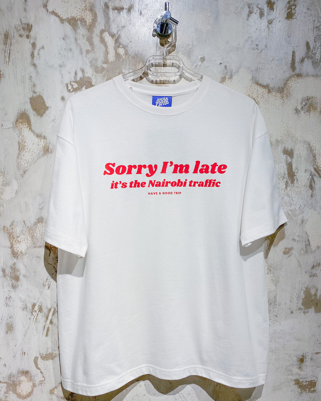 Sorry I'm Late Nairobi Traffic White T-Shirt with Red Ink